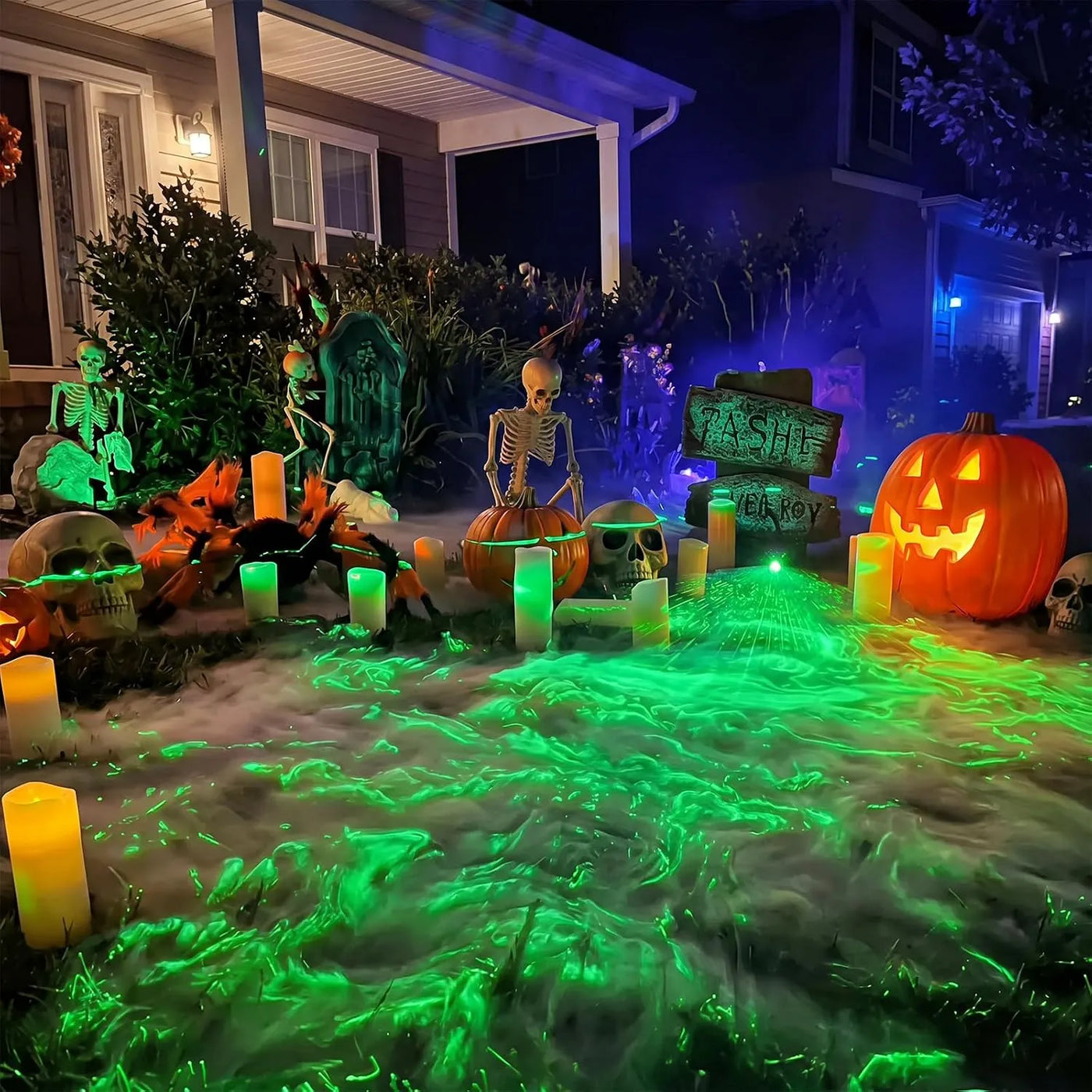 Outdoor Halloween yard with green laser swamp effect across low fog